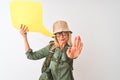 Senior hiker woman wearing canteen holding speech bubble over isolated white background with open hand doing stop sign with Royalty Free Stock Photo