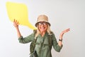 Senior hiker woman wearing canteen holding speech bubble over isolated white background very happy and excited, winner expression Royalty Free Stock Photo