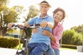 Senior Hispanic Couple Riding Bikes In Park Royalty Free Stock Photo