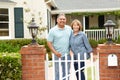 Senior Hispanic couple standing outside home Royalty Free Stock Photo
