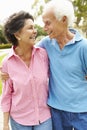 Senior Hispanic Couple Walking In Park Together Royalty Free Stock Photo