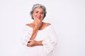 Senior hispanic grey- haired woman wearing casual clothes looking confident at the camera smiling with crossed arms and hand Royalty Free Stock Photo