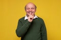 Senior hispanic man making silence gesture, keeping secret. Royalty Free Stock Photo