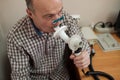 Senior hispanic man man testing breathing function by spirometry