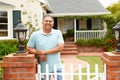 Senior Hispanic man outside home