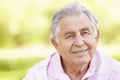 Senior Hispanic Man Relaxing In Park Royalty Free Stock Photo