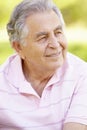 Senior Hispanic Man Relaxing In Park Royalty Free Stock Photo