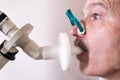 Senior hispanic man man testing breathing function by spirometry