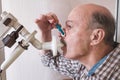 Senior hispanic man man testing breathing function by spirometry