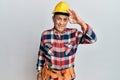 Senior hispanic man wearing handyman uniform smiling positive doing ok sign with hand and fingers Royalty Free Stock Photo