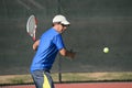 Senior Hispanic Playing Tennis