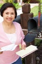 Senior Hispanic Woman Checking Mailbox Royalty Free Stock Photo