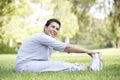 Senior Hispanic Woman Exercising In Park Royalty Free Stock Photo