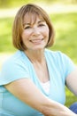 Senior Hispanic Woman Relaxing In Park Royalty Free Stock Photo