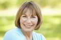 Senior Hispanic Woman Relaxing In Park Royalty Free Stock Photo