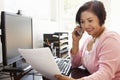 Senior Hispanic woman working on computer at home Royalty Free Stock Photo