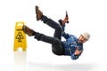 Hispanic Worker Falling on Wet Floor Royalty Free Stock Photo