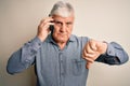 Senior hoary man having conversation talking on the smartphone over white background with angry face, negative sign showing Royalty Free Stock Photo