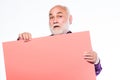 Senior holding blank sign board and looking at camera. Elderly people. Man bold head and gray beard hold poster for Royalty Free Stock Photo