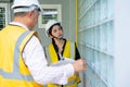 Senior home inspector checking home defects and teaching young engineers, before handing it over to client. Young engineers learn Royalty Free Stock Photo
