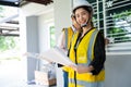 Senior home inspector checking home defects and teaching young engineers, before handing it over to client. Young engineers learn