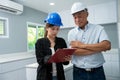 Senior home inspector checking home defects and teaching young engineers, before handing it over to client. Young engineers learn Royalty Free Stock Photo