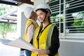 Senior home inspector checking home defects and teaching young engineers, before handing it over to client. Young engineers learn