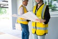 Senior home inspector checking home defects and teaching young engineers, before handing it over to client. Young engineers learn Royalty Free Stock Photo