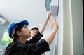 Senior home inspector checking home defects and teaching young engineers, before handing it over to client. Young engineers learn Royalty Free Stock Photo
