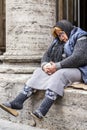 Senior homeless lady sleeping on the sidewalk in Rome, Italy Royalty Free Stock Photo