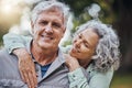 Senior hug, couple and marriage love in nature with a happy smile of people. Happiness of a elderly woman and man Royalty Free Stock Photo