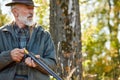 Older caucasian hunter looking away