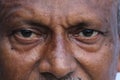 Senior Indian man`s eyes and wrinkles on skin close view.