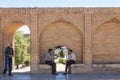 Senior iranian people, men, sitting and discussing on the archs of the Si o Seh Pol