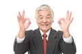 Senior Japanese businessman showing double perfect sign Royalty Free Stock Photo