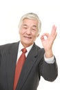 Senior Japanese businessman showing perfect sign Royalty Free Stock Photo