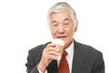 Senior Japanese businessman takes a coffee break Royalty Free Stock Photo