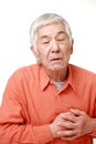 Senior Japanese man heart attack Royalty Free Stock Photo