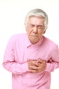 Senior Japanese man heart attack Royalty Free Stock Photo