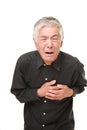 Senior Japanese man heart attack Royalty Free Stock Photo