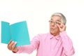 Senior Japanese man with presbyopia Royalty Free Stock Photo