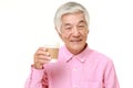 Senior Japanese man takes a coffee break Royalty Free Stock Photo