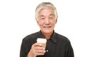 Senior Japanese man takes a coffee break Royalty Free Stock Photo