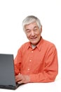 Senior Japanese man using laptop computer Royalty Free Stock Photo