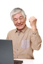 Senior Japanese  man using laptop computer Royalty Free Stock Photo