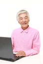 Senior Japanese man using laptop computer Royalty Free Stock Photo