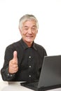 Senior Japanese man using laptop computer Royalty Free Stock Photo