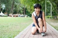 Senior jogger tighten her running shoe laces