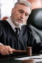 senior judge with blurred gavel sentencing