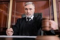 senior judge in mantle holding blurred